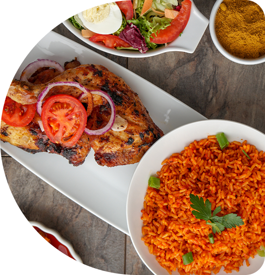 Grilled chicken, jollof rice and side salad plated at Potmasters