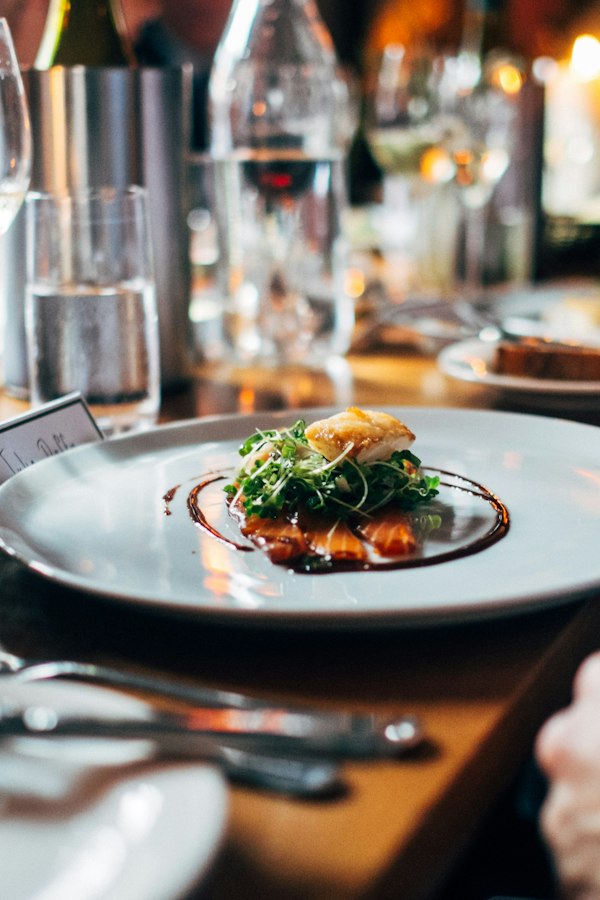 Table set with a plated meal and drinks at Potmasters