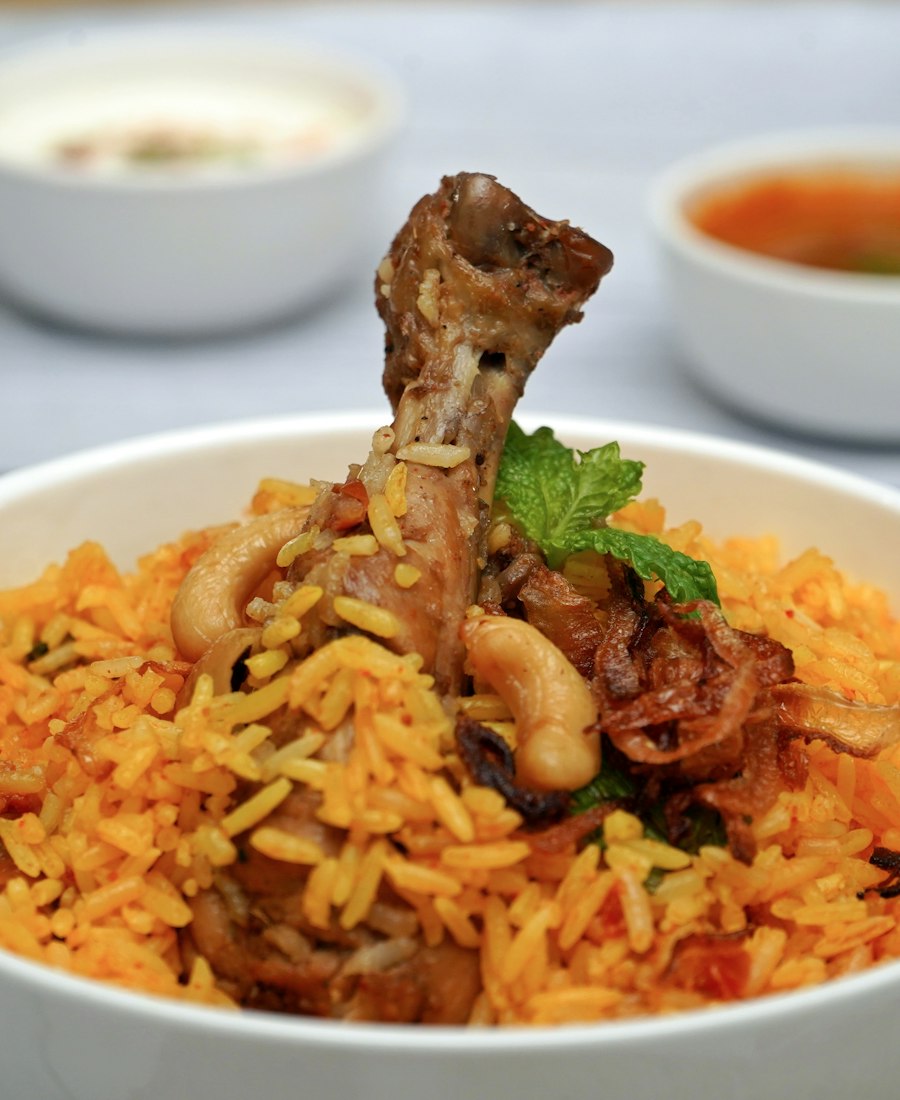 Grilled chicken with jollof rice, salad and spices